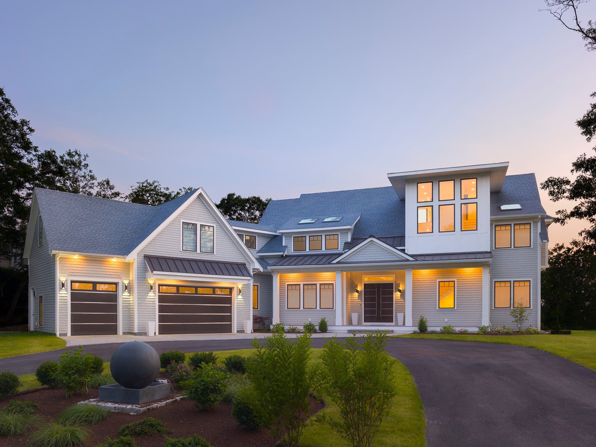 Cape Cod custom home at dusk