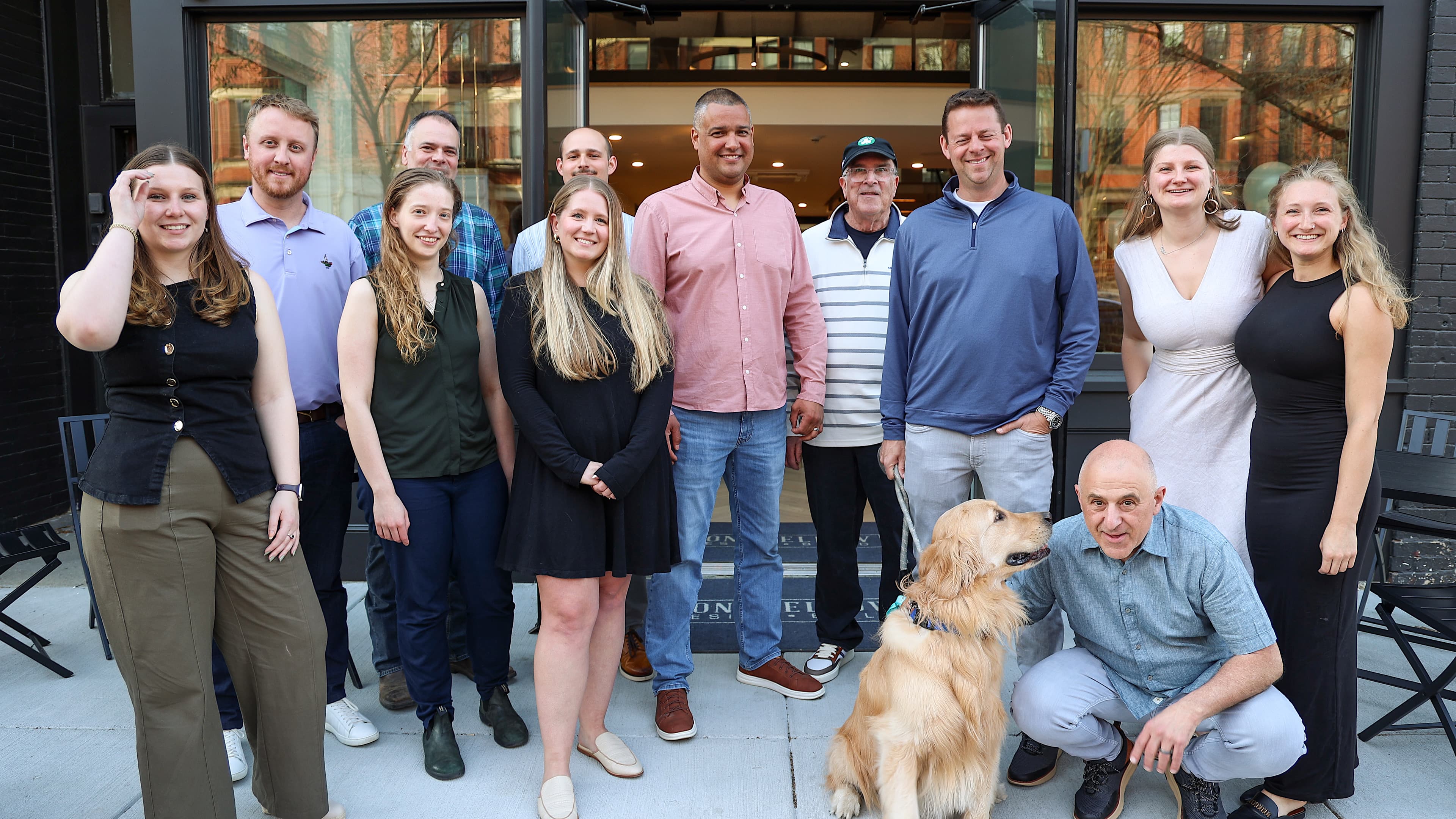 Longfellow Design Build team gathered outside the Boston South End showroom/office