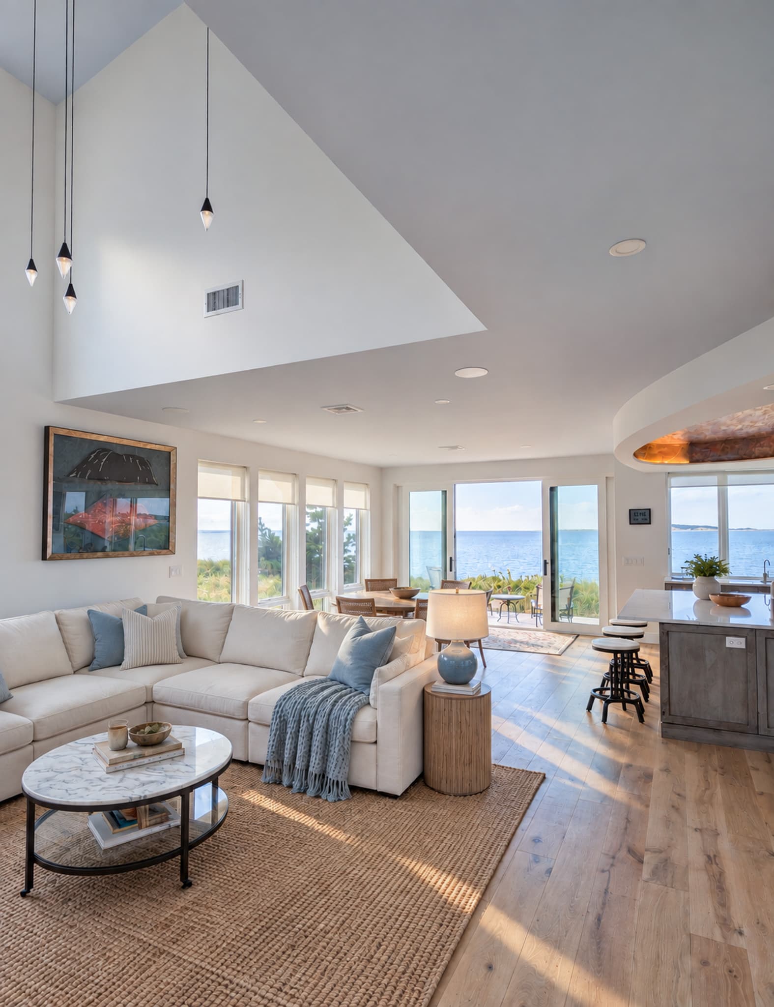 The first floor, 1,092 square feet, holds kitchen, dining and living in one space along the water side.